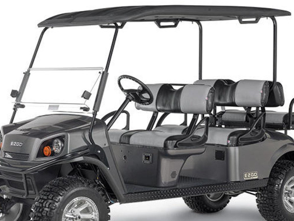 a truck that is sitting on a motorcycle